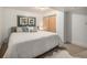 Well-lit bedroom with comfortable bedding, closet, and contemporary art for a comfortable retreat at 6532 S Field Way, Littleton, CO 80123