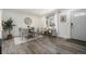 Inviting dining area with modern decor, a round table, and large windows with bright natural light at 6532 S Field Way, Littleton, CO 80123