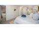 Relaxing bedroom showcasing a decorative rug, white furniture, and a large window for natural light at 6532 S Field Way, Littleton, CO 80123