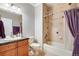 Bathroom featuring vanity, tiled floors, and shower/tub combo at 15501 E 112Th Ave # 33D, Commerce City, CO 80022