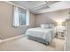 Cozy bedroom featuring plush carpet, natural light, and calming neutral color palette for a relaxing atmosphere at 15501 E 112Th Ave # 33D, Commerce City, CO 80022