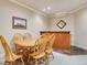 Basement dining area with wood table, chairs, and kitchenette at 15501 E 112Th Ave # 33D, Commerce City, CO 80022