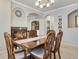 Elegant dining room with wood table, chairs, fireplace, and chandelier lighting at 15501 E 112Th Ave # 33D, Commerce City, CO 80022