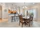 Bright dining area with chandelier, bar seating and large window at 15501 E 112Th Ave # 33D, Commerce City, CO 80022
