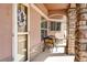 Inviting front porch with cozy seating, stone accents, and a decorative wreath on the door at 15501 E 112Th Ave # 33D, Commerce City, CO 80022