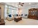 Bright living room features large windows, neutral décor and traditional furnishings at 15501 E 112Th Ave # 33D, Commerce City, CO 80022