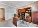 Office with custom built-ins, spacious desk area, and neutral carpeting at 15501 E 112Th Ave # 33D, Commerce City, CO 80022