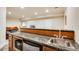 Basement wet bar features granite countertop, sink, and a microwave at 15501 E 112Th Ave # 33D, Commerce City, CO 80022