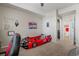 Large bedroom with a racecar bed, ceiling fan, and a walk-in closet for organized storage at 15460 Canyon Gulch Ln # 105, Englewood, CO 80112
