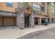The entryway features stone accents, a well-kept lawn, and a single-car garage at 15460 Canyon Gulch Ln # 105, Englewood, CO 80112