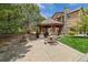 Inviting outdoor gazebo featuring stone columns, wood accents, and ample seating, perfect for gatherings and relaxing at 15460 Canyon Gulch Ln # 105, Englewood, CO 80112