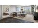 Inviting living room featuring a comfortable gray couch and natural light at 15460 Canyon Gulch Ln # 105, Englewood, CO 80112