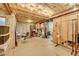 Unfinished basement with concrete floors, exposed ceiling, and utilities at 2862 W Long Dr # A, Littleton, CO 80120