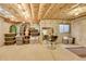 Unfinished basement with concrete walls and ceiling, along with storage containers and potential for customization at 2862 W Long Dr # A, Littleton, CO 80120