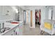 Bedroom featuring a crib, a growth chart, and closet at 2862 W Long Dr # A, Littleton, CO 80120