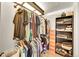 Walk-in closet equipped with rods, shelves and containers for optimal storage at 2862 W Long Dr # A, Littleton, CO 80120