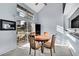 Cozy dining area with backyard access and natural light from large, grid-style windows at 2862 W Long Dr # A, Littleton, CO 80120