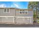 The exterior of the unit features an attached garage, providing convenient parking at 2862 W Long Dr # A, Littleton, CO 80120
