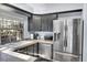 Updated kitchen featuring stainless steel appliances and neutral countertops at 2862 W Long Dr # A, Littleton, CO 80120