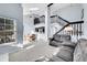 Bright living room boasts a skylight, vaulted ceiling, and seamless flow into the dining area at 2862 W Long Dr # A, Littleton, CO 80120