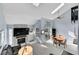 Bright living room with vaulted ceilings, fireplace, and sliding door access to the outside at 2862 W Long Dr # A, Littleton, CO 80120
