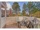 A fenced patio featuring a table, chairs, and covered grill, ideal for outdoor dining and relaxation at 2862 W Long Dr # A, Littleton, CO 80120