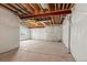 Unfinished basement with exposed beams and a concrete floor ready for your personal touch at 2662 E 103Rd Ave, Thornton, CO 80229