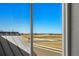 A clear view out a window shows open land and mountains at 2662 E 103Rd Ave, Thornton, CO 80229