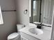 Modern bathroom features black fixtures and neutral finishes at 1759 Jennifer St, Brighton, CO 80601