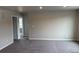 Carpeted bonus room providing additional living space and comfort at 1759 Jennifer St, Brighton, CO 80601
