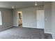Large bedroom with neutral walls, plush carpeting, closet doors, and an en-suite bathroom at 1759 Jennifer St, Brighton, CO 80601