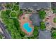 Overhead view of the community pool, landscaping, and parking areas at 5255 Memphis St # 1009, Denver, CO 80239