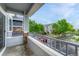 Balcony provides views of the neighborhood with lush greenery, parking areas, and well maintained buildings at 5255 Memphis St # 1009, Denver, CO 80239