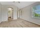 Spacious bedroom featuring neutral carpet, a bright window, and ensuite bathroom access at 5255 Memphis St # 1009, Denver, CO 80239