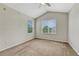 Bright bedroom with a vaulted ceiling, neutral carpet, and large windows that let in ample light at 5255 Memphis St # 1009, Denver, CO 80239