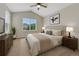 Well-lit bedroom with a window view, neutral tones, and standard furnishings at 5255 Memphis St # 1009, Denver, CO 80239