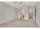 Spacious bedroom featuring vaulted ceiling, neutral paint, carpet, and ample closet space at 5255 Memphis St # 1009, Denver, CO 80239