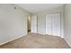 Neutral bedroom with a carpeted floor and a spacious closet for storage at 5255 Memphis St # 1009, Denver, CO 80239
