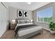 Comfortable bedroom with neutral decor, large window, and stylish furnishings at 5255 Memphis St # 1009, Denver, CO 80239