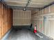 Garage featuring interior view of the parking space with concrete floor and an open ceiling at 5255 Memphis St # 1009, Denver, CO 80239