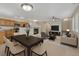 Bright, open living room features a fireplace, modern decor, and seamless flow to the dining area at 5255 Memphis St # 1009, Denver, CO 80239