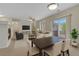 Comfortable living room with a fireplace, ceiling fan and access to outdoor patio at 5255 Memphis St # 1009, Denver, CO 80239