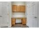 Convenient home office area with built-in desk, cabinets and wood floors at 5255 Memphis St # 1009, Denver, CO 80239