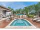 Community pool area offering multiple pools and lounge seating surrounded by lush trees and manicured landscaping at 5255 Memphis St # 1009, Denver, CO 80239