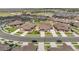 Wide aerial shot showcasing a modern residential community with neatly arranged homes and landscaped streets at 25059 E Alder Dr, Aurora, CO 80016