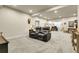 Carpeted basement rec room featuring a reclining sofa and recessed lighting at 25059 E Alder Dr, Aurora, CO 80016