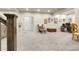 A finished basement featuring neutral carpet and an armchair with ottoman at 25059 E Alder Dr, Aurora, CO 80016
