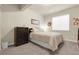 Bedroom with carpet, a floral comforter, a window and a chest of drawers at 25059 E Alder Dr, Aurora, CO 80016