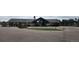 Community clubhouse entrance with a covered entryway and surrounding landscape at 25059 E Alder Dr, Aurora, CO 80016
