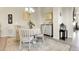 Bright dining room with a neutral color palette and elegant chandelier, perfect for entertaining guests at 25059 E Alder Dr, Aurora, CO 80016